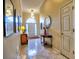 Bright and inviting foyer featuring tiled floors, an arched entry, and elegant decor at 4103 Christacy Way, Marietta, GA 30066
