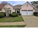 Charming single-story home featuring a well-manicured lawn, a two-car garage, and a welcoming entrance at 4103 Christacy Way, Marietta, GA 30066