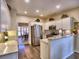 Modern kitchen with white cabinetry, stainless steel appliances, and a breakfast bar, great for casual dining at 4103 Christacy Way, Marietta, GA 30066