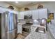 Stylish kitchen features stainless steel appliances, granite countertops, and white cabinets, offering a sleek design at 4103 Christacy Way, Marietta, GA 30066