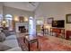 Open living room with a fireplace, vaulted ceiling, and ample natural light, ideal for gatherings and everyday living at 4103 Christacy Way, Marietta, GA 30066