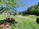 Charming picnic area with a wooden table, swing, and a picturesque view of the surrounding greenery at 4103 Christacy Way, Marietta, GA 30066
