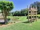 Picturesque pond with a swing and lush greenery, creating a tranquil and inviting outdoor space at 4103 Christacy Way, Marietta, GA 30066