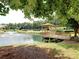 Scenic view of the pond featuring a fountain and a gazebo on a deck, enhancing the serene ambiance at 4103 Christacy Way, Marietta, GA 30066