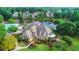 Aerial view of community clubhouse and pool overlooking a tranquil pond at 12350 Edenwilde Dr, Roswell, GA 30075