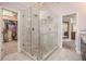 Bathroom featuring a glass walk-in shower, and entry to walk-in closet at 12350 Edenwilde Dr, Roswell, GA 30075