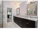 Bathroom featuring double sinks, granite countertops, and a glass walk-in shower at 12350 Edenwilde Dr, Roswell, GA 30075