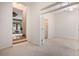 Bright bonus room with French doors, neutral walls and access to other rooms at 12350 Edenwilde Dr, Roswell, GA 30075