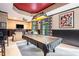 Entertaining game room with a pool table and relaxing seating areas at 12350 Edenwilde Dr, Roswell, GA 30075