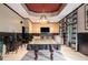 Spacious game room with a pool table, TV area, and black and white accents at 12350 Edenwilde Dr, Roswell, GA 30075