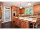 Gourmet kitchen with custom wood cabinets, granite countertops, and stainless steel appliances at 12350 Edenwilde Dr, Roswell, GA 30075
