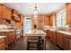 Gourmet kitchen with custom wood cabinets, granite countertops, and stainless steel appliances at 12350 Edenwilde Dr, Roswell, GA 30075