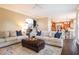 Inviting living room featuring hardwood floors, plush sofas, and an open floor plan at 12350 Edenwilde Dr, Roswell, GA 30075