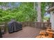 Outdoor deck with built-in grill and seating area, perfect for entertaining at 12350 Edenwilde Dr, Roswell, GA 30075