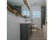 Updated bathroom features unique tile flooring, dark vanity and new fixtures at 1920 W Forrest Ave, Atlanta, GA 30344