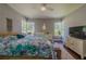 Spacious bedroom with ceiling fan and windows providing natural light at 1920 W Forrest Ave, Atlanta, GA 30344