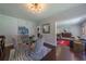 Chic dining area with a glass table, modern lighting, and seamless access to the living room at 1920 W Forrest Ave, Atlanta, GA 30344