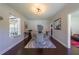 Stylish dining room with modern light fixture, hardwood floors, and view to living room at 1920 W Forrest Ave, Atlanta, GA 30344