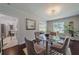 Bright dining room features hardwood floors, neutral paint and a glass table at 1920 W Forrest Ave, Atlanta, GA 30344