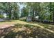 Expansive front yard with mature trees and a well-maintained lawn, enhancing the home's curb appeal at 1920 W Forrest Ave, Atlanta, GA 30344