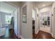 Hallway showcasing hardwood floors and access to multiple rooms at 1920 W Forrest Ave, Atlanta, GA 30344