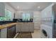 Bright kitchen featuring stainless appliances, butcher block counters and washer/dryer at 1920 W Forrest Ave, Atlanta, GA 30344