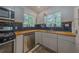 Charming kitchen featuring stainless appliances, butcher block counters, and blue backsplash at 1920 W Forrest Ave, Atlanta, GA 30344