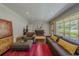 Bright living area featuring hardwood floors, stylish decor, and a large window at 1920 W Forrest Ave, Atlanta, GA 30344