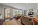 Spacious living room showcasing hardwood floors, recessed lighting, and a modern entrance door at 1920 W Forrest Ave, Atlanta, GA 30344