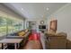 Open-concept living space with hardwood floors, a large window, and neutral color palette at 1920 W Forrest Ave, Atlanta, GA 30344