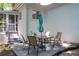 Outdoor patio with a table and chairs, perfect for enjoying meals and relaxing in the backyard at 1920 W Forrest Ave, Atlanta, GA 30344