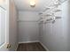 Walk-in closet features built-in shelving and ample storage space at 225 Bentley Pl, Tucker, GA 30084