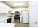 Updated kitchen with stainless appliances, white cabinets, and marble countertops at 225 Bentley Pl, Tucker, GA 30084