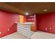 A well-appointed basement features a unique bar area with seating and lighting at 2683 Fleur De Lis Pl, Atlanta, GA 30360