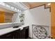 A half-bath features art deco styling with a modern bowl sink and unique fixtures at 2683 Fleur De Lis Pl, Atlanta, GA 30360