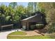 Modern home exterior with carport, natural landscaping, and driveway at 2683 Fleur De Lis Pl, Atlanta, GA 30360