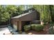 Unique modern home featuring a striking exterior and lush surrounding landscape at 2683 Fleur De Lis Pl, Atlanta, GA 30360