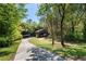 Well-maintained single Gathering home with unique architectural details and mature landscaping at 2683 Fleur De Lis Pl, Atlanta, GA 30360