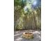 A stone fire pit in the bamboo forest, complete with hammock and seating at 2683 Fleur De Lis Pl, Atlanta, GA 30360