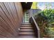 Inviting front entrance with wooden steps leading to a contemporary door with glass panels at 2683 Fleur De Lis Pl, Atlanta, GA 30360