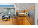 Open kitchen featuring bar seating, modern stainless-steel appliances, and sleek countertops at 2683 Fleur De Lis Pl, Atlanta, GA 30360