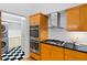 Modern kitchen beside a laundry room with stacked washer and dryer and black and white tile at 2683 Fleur De Lis Pl, Atlanta, GA 30360