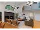 Open living room with hardwood floors, a fireplace, and large windows offering natural light at 2683 Fleur De Lis Pl, Atlanta, GA 30360