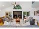 Spacious living room featuring a fireplace, modern furnishings and plenty of natural light at 2683 Fleur De Lis Pl, Atlanta, GA 30360