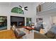Inviting living room with a fireplace, hardwood floors, and comfortable modern seating at 2683 Fleur De Lis Pl, Atlanta, GA 30360