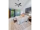 Spacious main bedroom features a neutral color scheme, vaulted ceiling, ceiling fan, and a sitting area with natural light at 2683 Fleur De Lis Pl, Atlanta, GA 30360