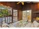 A covered outdoor porch creates a calm, secluded area with forest views at 2683 Fleur De Lis Pl, Atlanta, GA 30360