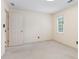 Carpeted bedroom with neutral paint and a single window in a well lit room at 8920 Willowbrae Ln, Roswell, GA 30076