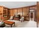 Spacious living room with fireplace, custom built-ins, and cozy seating, perfect for entertaining at 8920 Willowbrae Ln, Roswell, GA 30076