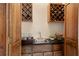 This home features a beautifully designed wet bar with wood cabinets and countertop at 8920 Willowbrae Ln, Roswell, GA 30076